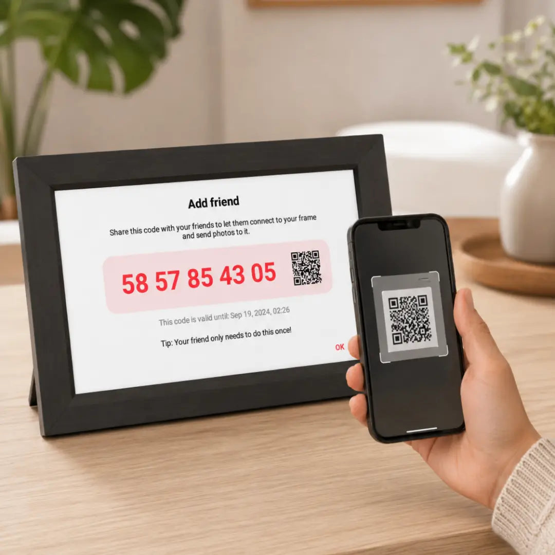 Phone scanning a Frameo QR code to connect with a Lifeframe digital photo frame.