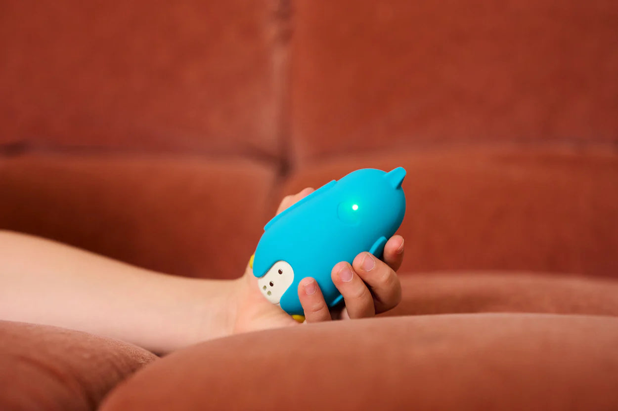 Moonbuddy calming device showing how children breathe along with soft light and gentle movement.