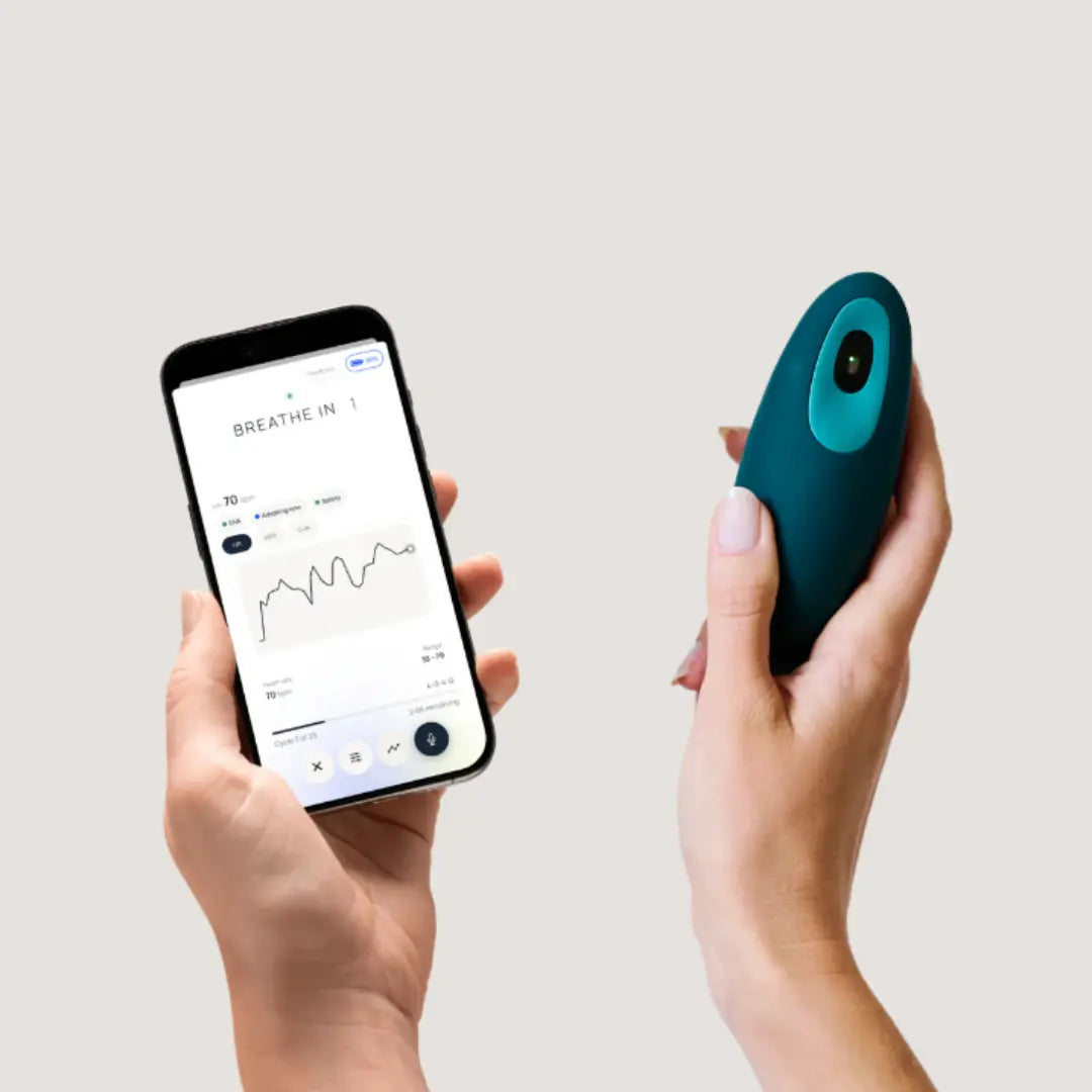 Moonbird breathing coach held beside the Moonbird app showing guided breathing session data.
